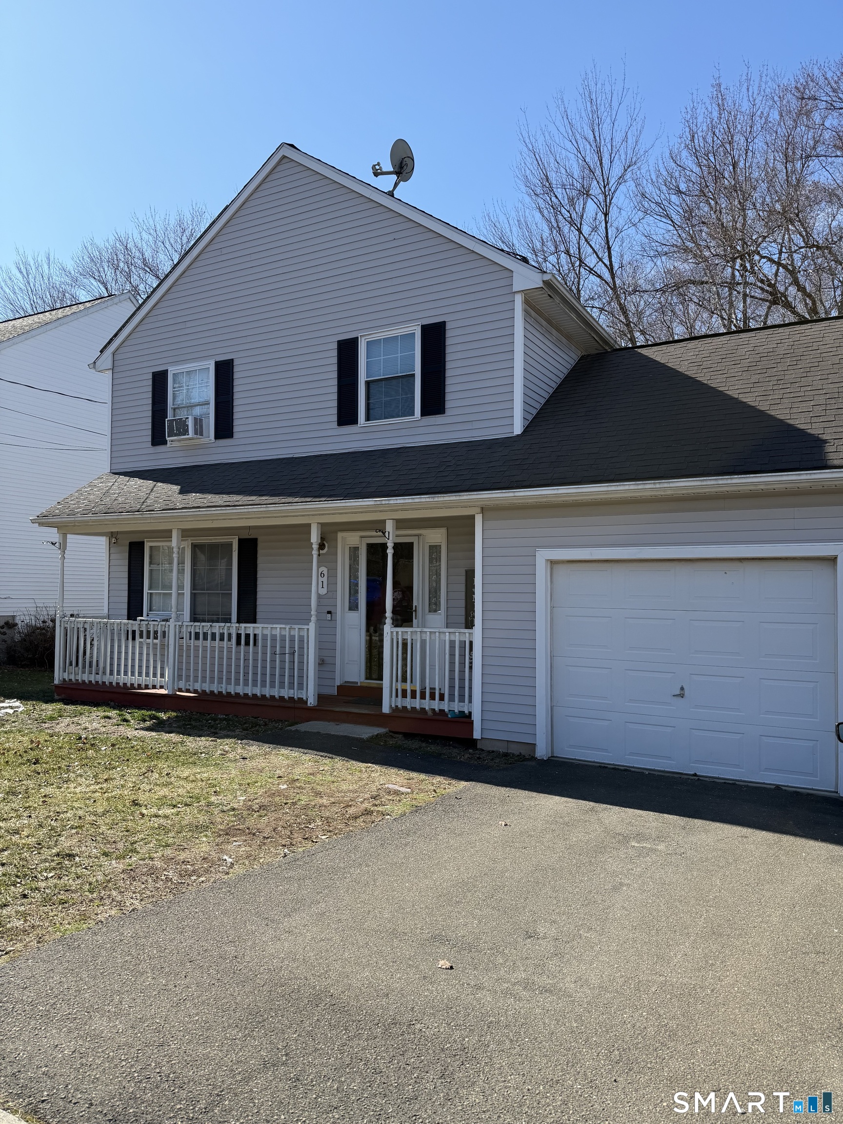 61 Victoria Court Hamden, CT 06514 - Photo 1 of 10 a front view of a house with a yard