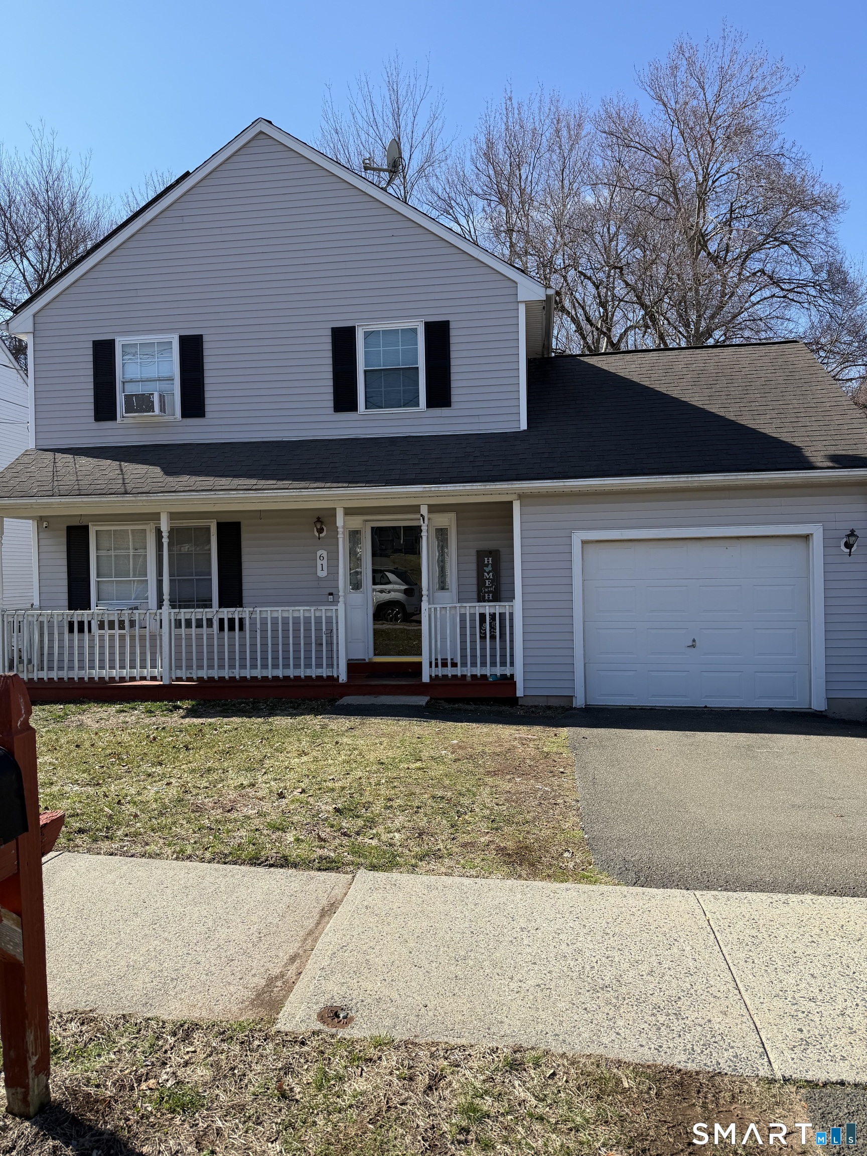 61 Victoria Court Hamden, CT 06514 - Photo 2 of 10 a front view of a house with a yard