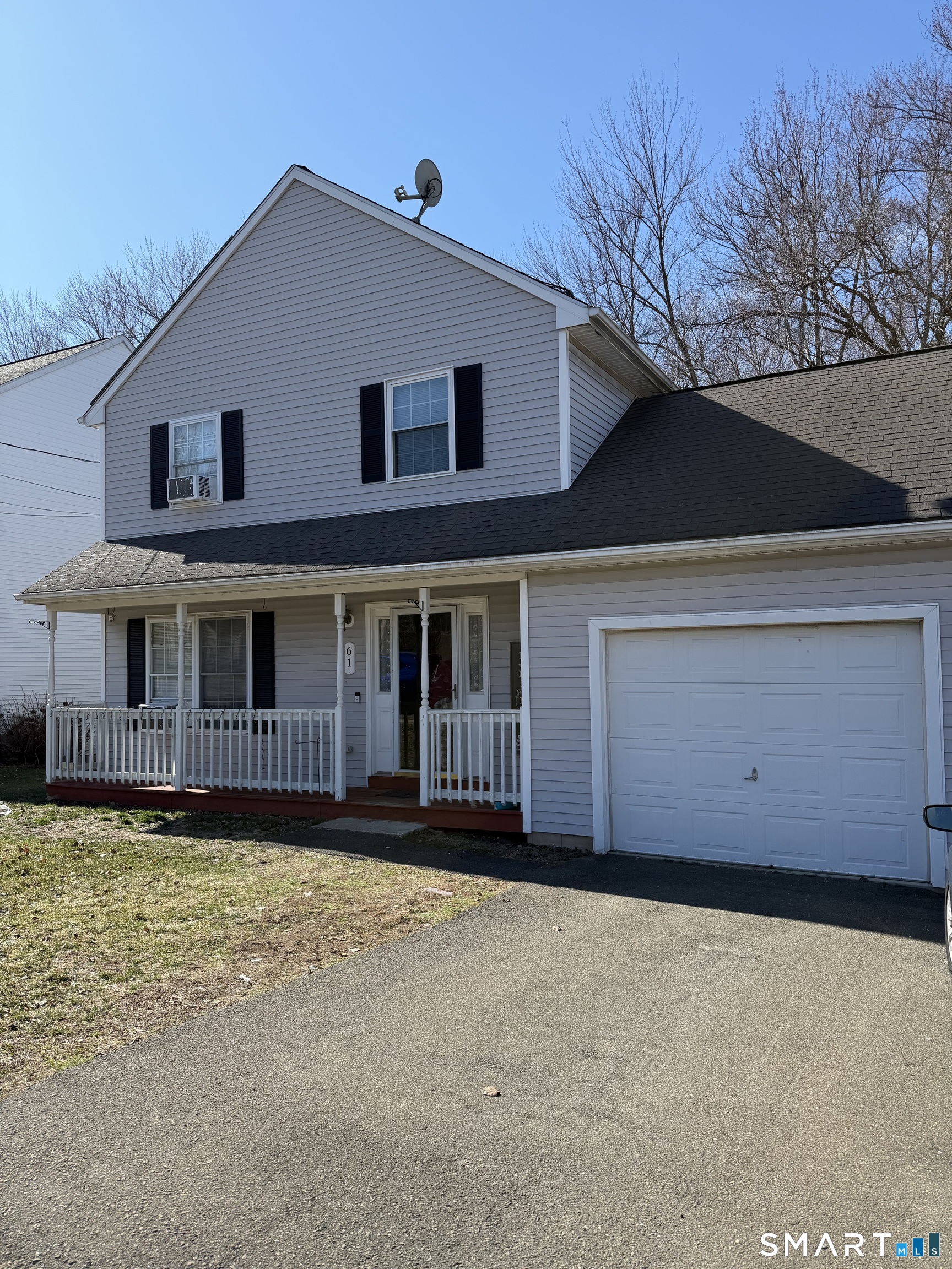 61 Victoria Court Hamden, CT 06514 - Photo 3 of 10 a front view of a house with a yard
