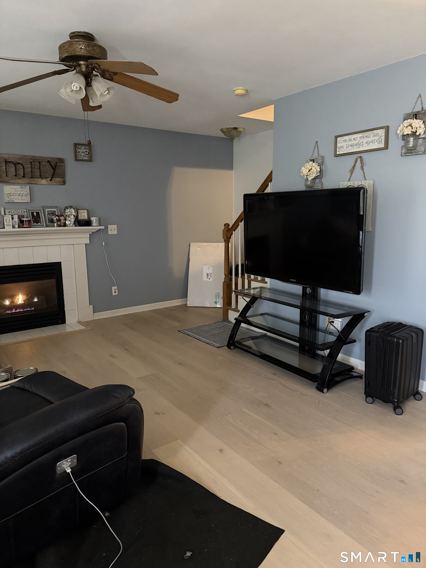 61 Victoria Court Hamden, CT 06514 - Photo 5 of 10 a living room with furniture and a fireplace