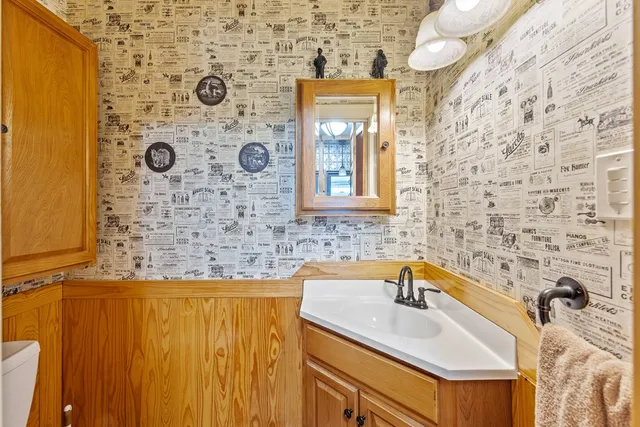 a view of a house with a yard covered with snow