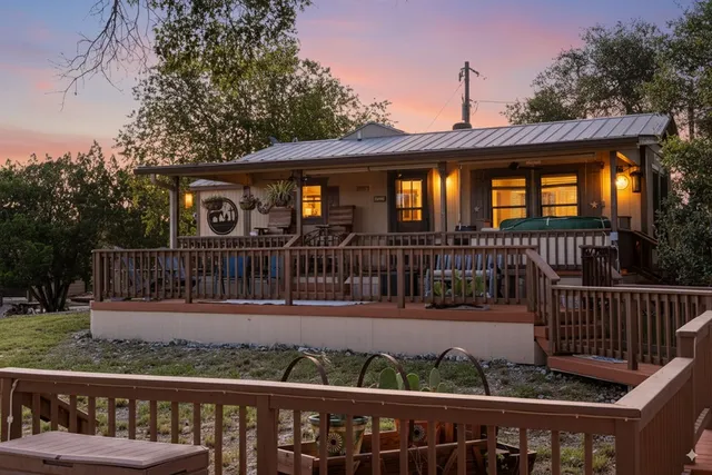 an aerial view of town with residential houses with outdoor space and trees