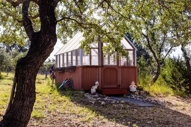 a view of a house with a mountain in the background