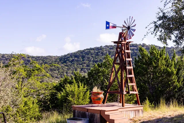a view of a house with backyard porch and sitting area