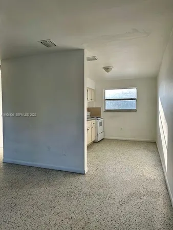 a view of a room with closet and windows