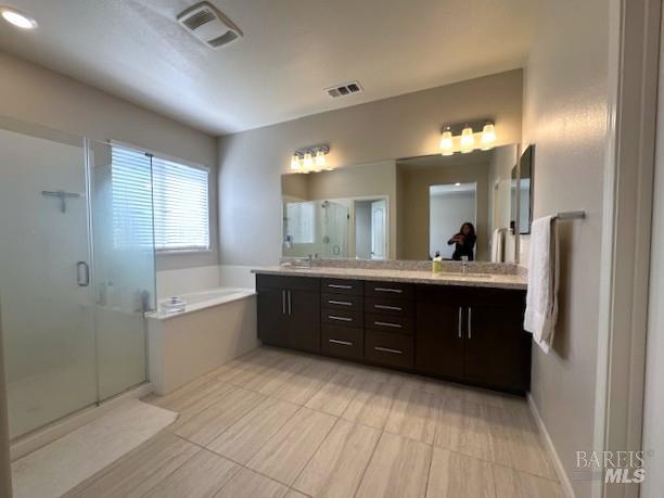 5204 Kim Place Rohnert Park, CA 94928 - Photo 8 of 13 a spacious bathroom with a granite countertop sink a mirror and a bathtub
