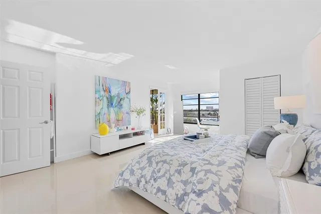 a bedroom with a bed and dresser