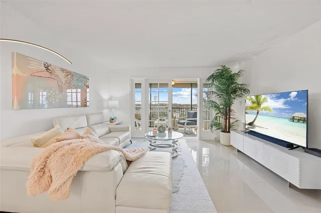 a bed room with a bed and a large window