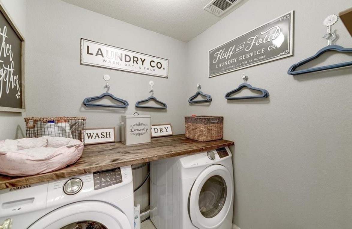 1307 Ridgewood Drive Leander, TX 78641 - Photo 14 of 16 a utility room with dryer and washer