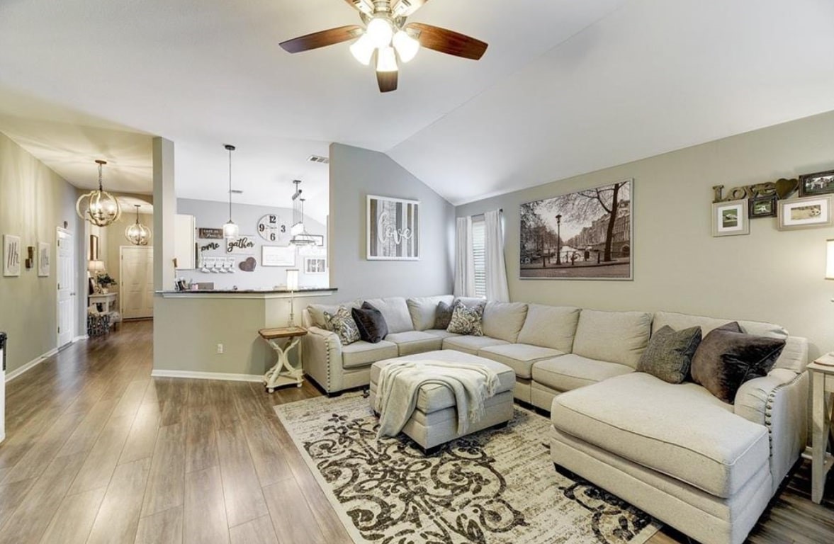 1307 Ridgewood Drive Leander, TX 78641 - Photo 2 of 16 a living room with furniture and wooden floor