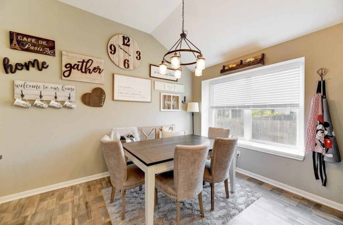 1307 Ridgewood Drive Leander, TX 78641 - Photo 6 of 16 a view of a dining room with furniture window and outside view