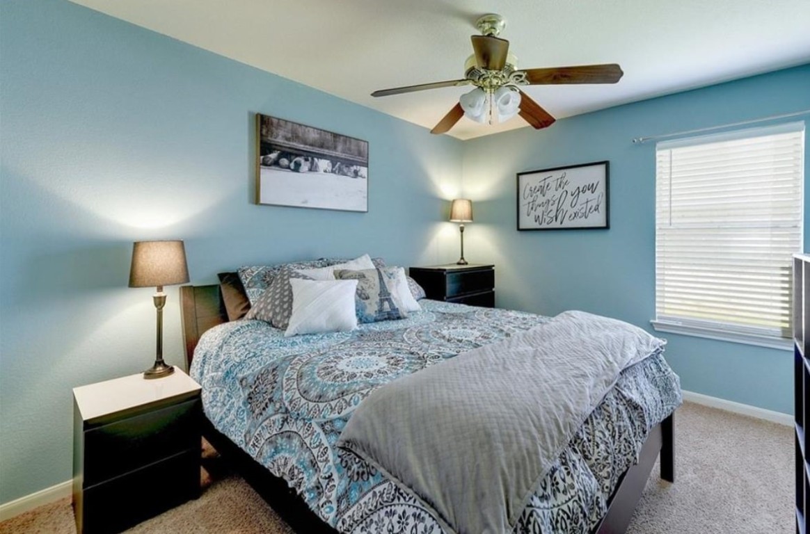 1307 Ridgewood Drive Leander, TX 78641 - Photo 8 of 16 a bedroom with bed and a window