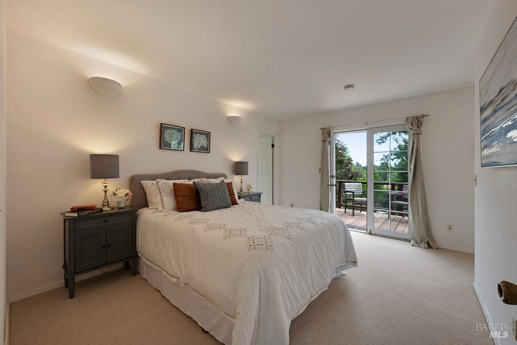 4542 Thomas Road Sebastopol, CA 95472 - Photo 27 of 60 a bedroom with a bed and a large window