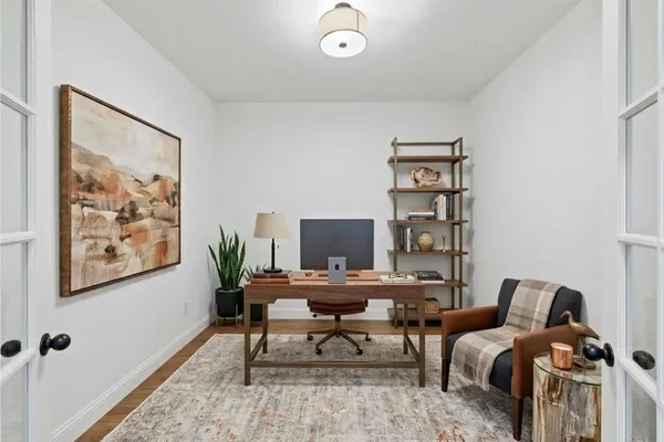 a workspace with furniture and window