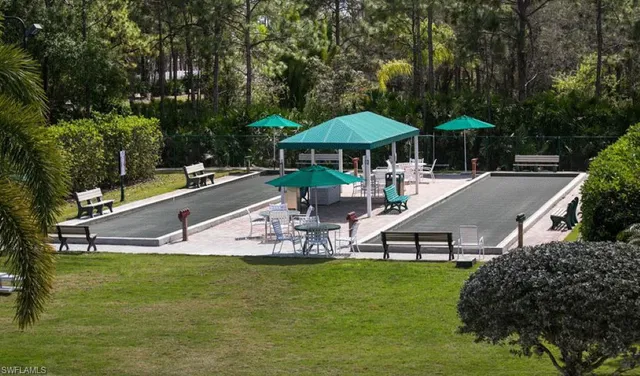 a view of a house with a yard and sitting area