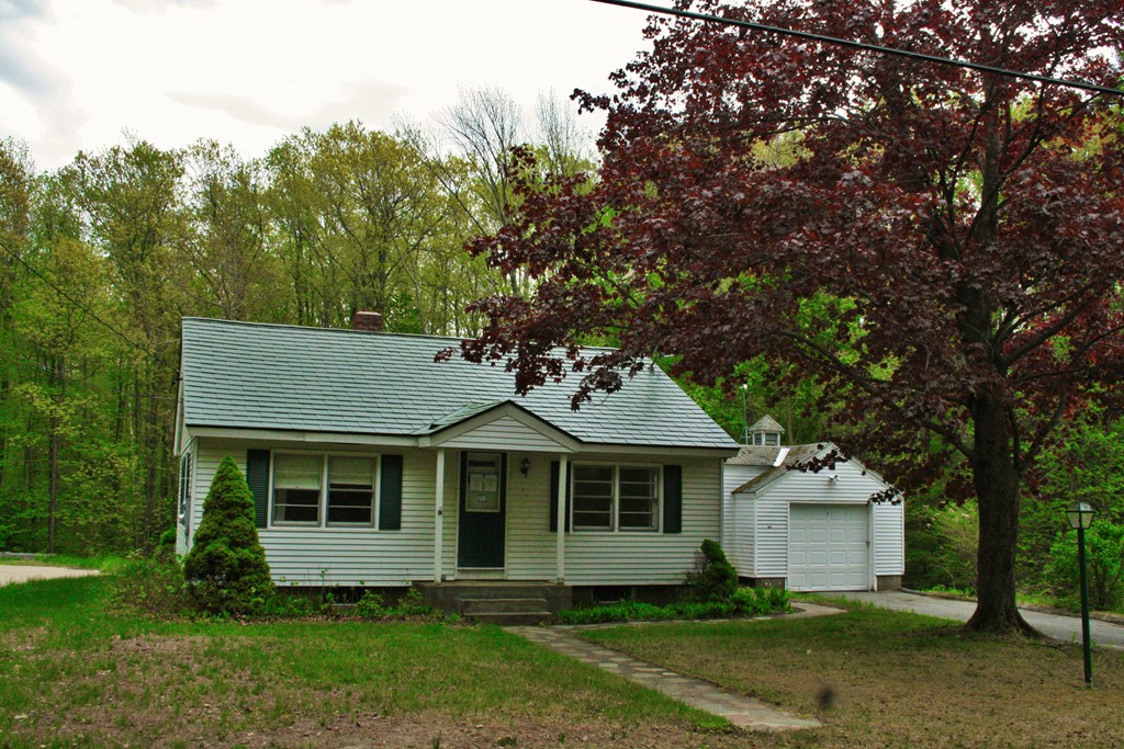 362 Mirick Road Princeton, MA 01541 - Photo 1 of 13 a front view of a house with a garden
