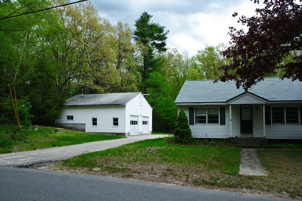 362 Mirick Road Princeton, MA 01541 - Photo 2 of 13 a front view of a house with a garden