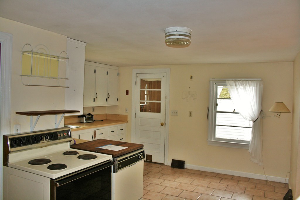 362 Mirick Road Princeton, MA 01541 - Photo 7 of 13 a kitchen with a stove and a microwave