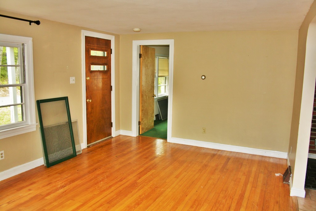 362 Mirick Road Princeton, MA 01541 - Photo 10 of 13 an empty room with wooden floor and windows