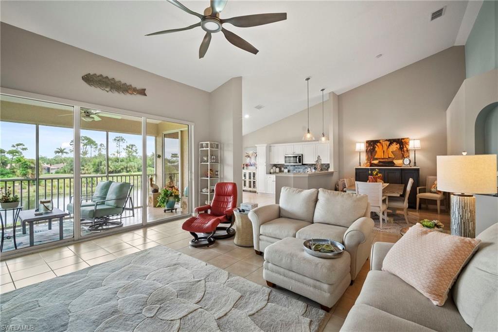20051 Seagrove Street, Unit 1207 Estero, FL 33928 - Photo 11 of 32 a living room with furniture and a large window