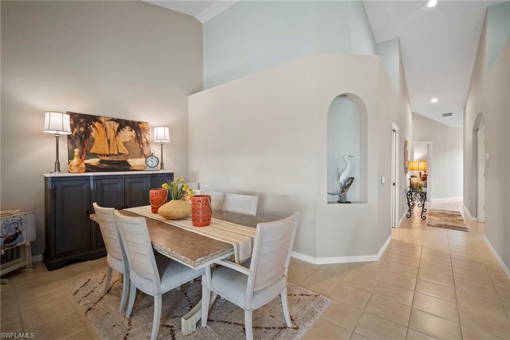 20051 Seagrove Street, Unit 1207 Estero, FL 33928 - Photo 12 of 32 a dining room with furniture and window