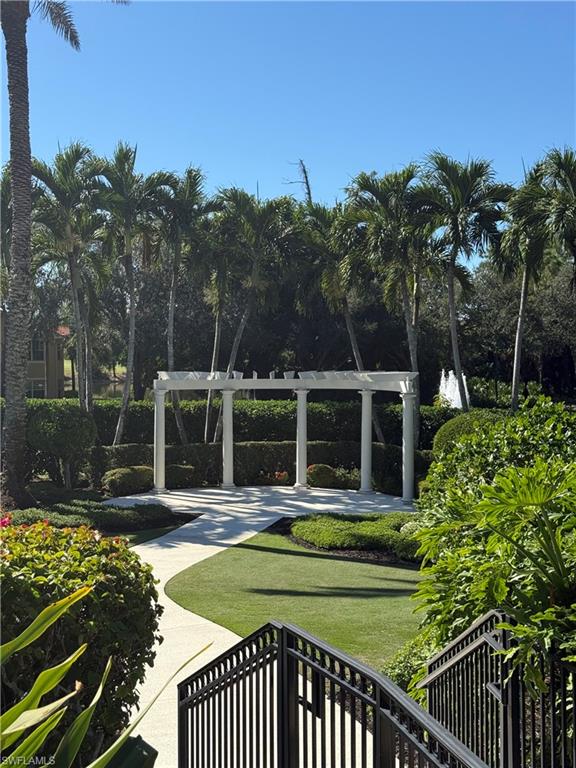 20051 Seagrove Street, Unit 1207 Estero, FL 33928 - Photo 27 of 32 a view of a house with a yard patio and swimming pool
