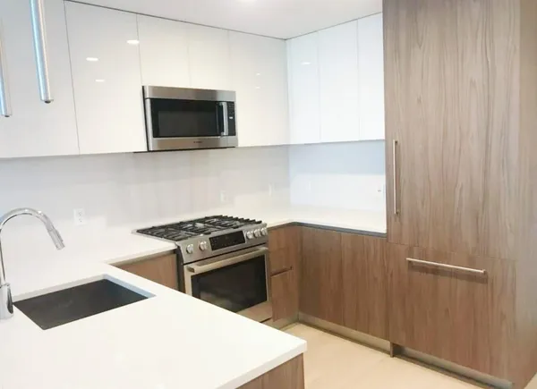a kitchen with a stove and a microwave