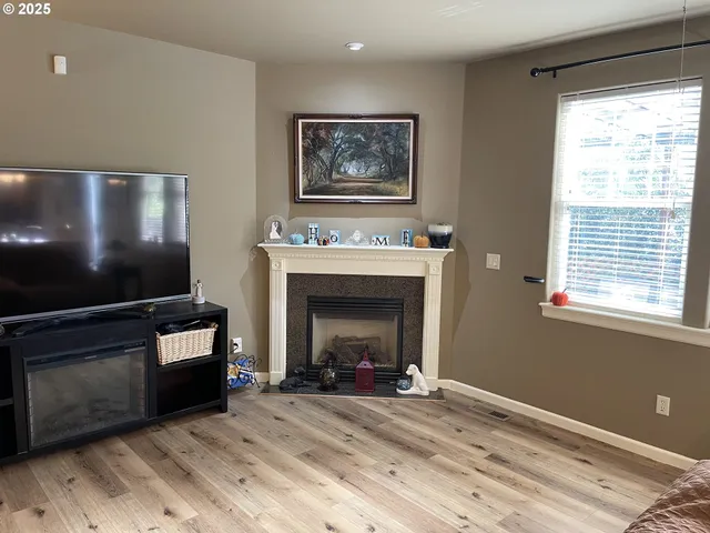 a view of backyard with table and chairs and potted plants