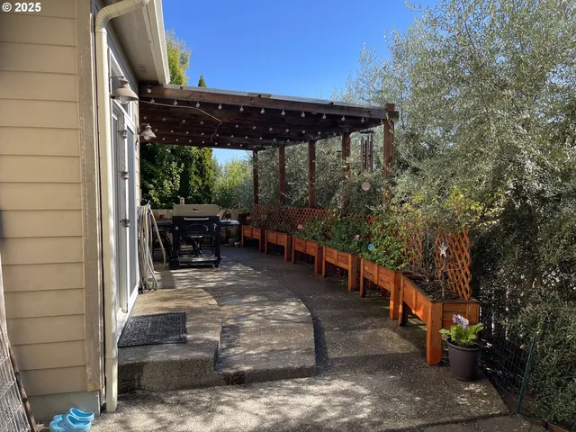 a view of a backyard with a patio and outdoor seating
