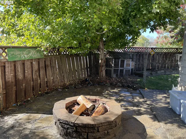 a view of a backyard with swimming pool