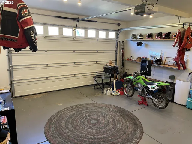 a gym room with lots of white furniture and clutter