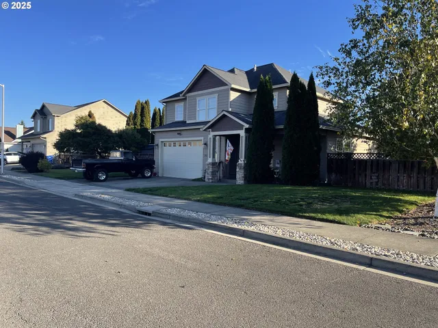 a view of a hallway with windows and stairs