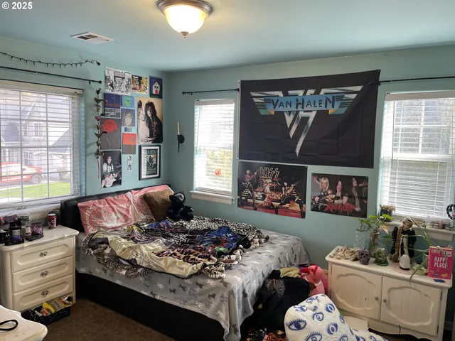 a view of a street with a building in the background