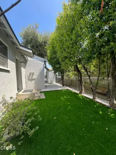 a view of a back yard of the house