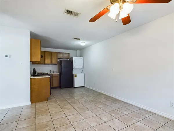 a kitchen with stainless steel appliances a cabinets and a counter top