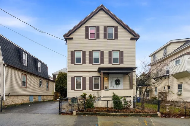 a front view of a house with garage