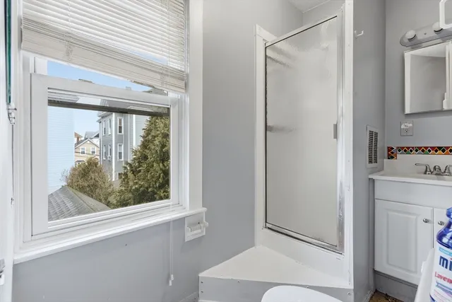 a bathroom with a toilet sink and a mirror
