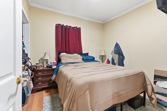 a bedroom with a bed and a closet