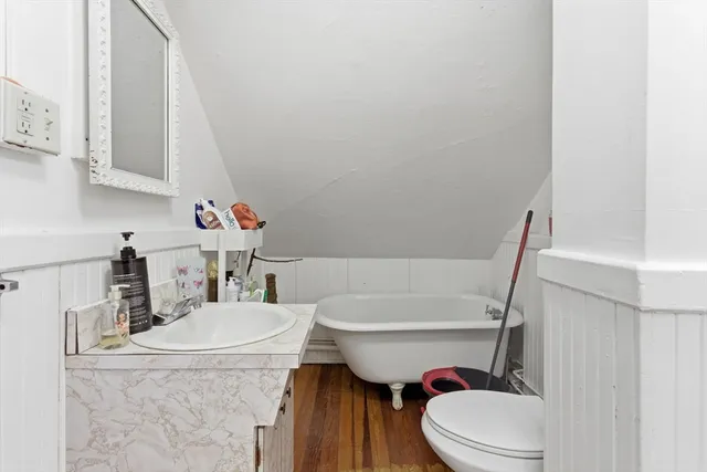 a bathroom with a sink a toilet and bathtub