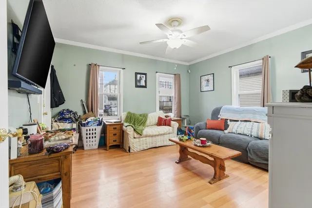 a living room with furniture fireplace and a flat screen tv