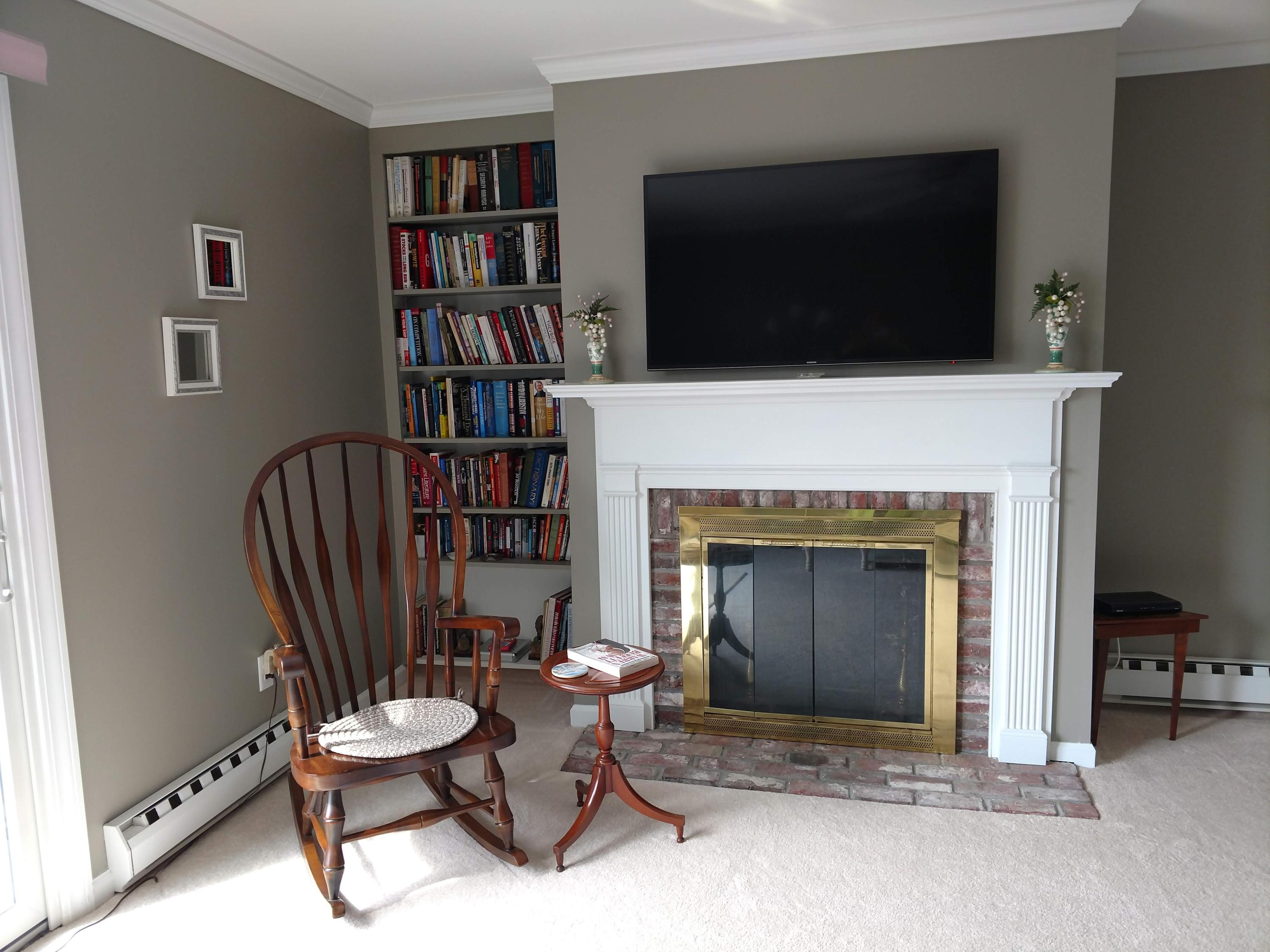 683 Old Post Road, Unit U18 Dennis, MA 02638 - Photo 4 of 26 a living room with fireplace furniture and a flat screen tv