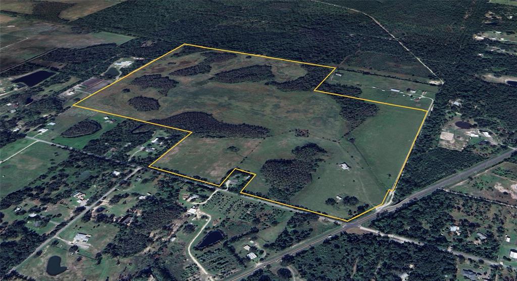 1092 State Rte 415 New Smyrna Beach, FL 32168 - Photo 2 of 9 an aerial view of a backyard