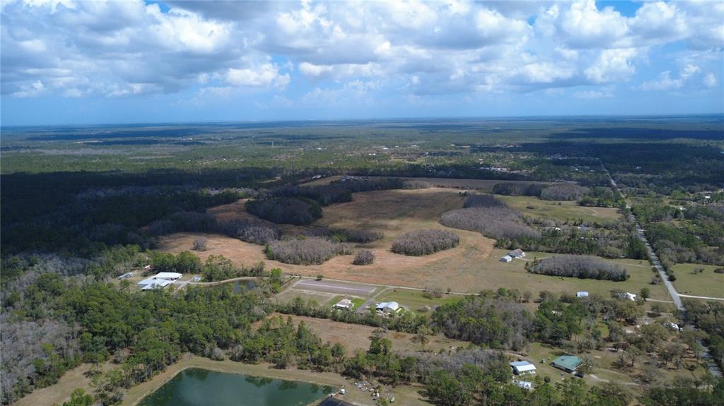 1092 State Rte 415 New Smyrna Beach, FL 32168 - Photo 4 of 9 a view of a lake with mountains in the background