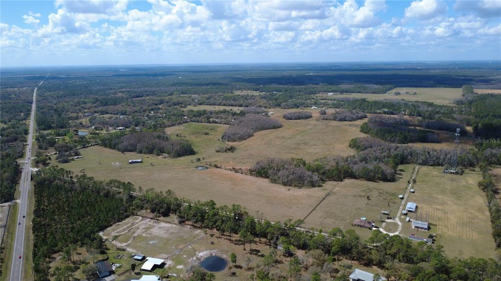 1092 State Rte 415 New Smyrna Beach, FL 32168 - Photo 7 of 9 aerial view of a city