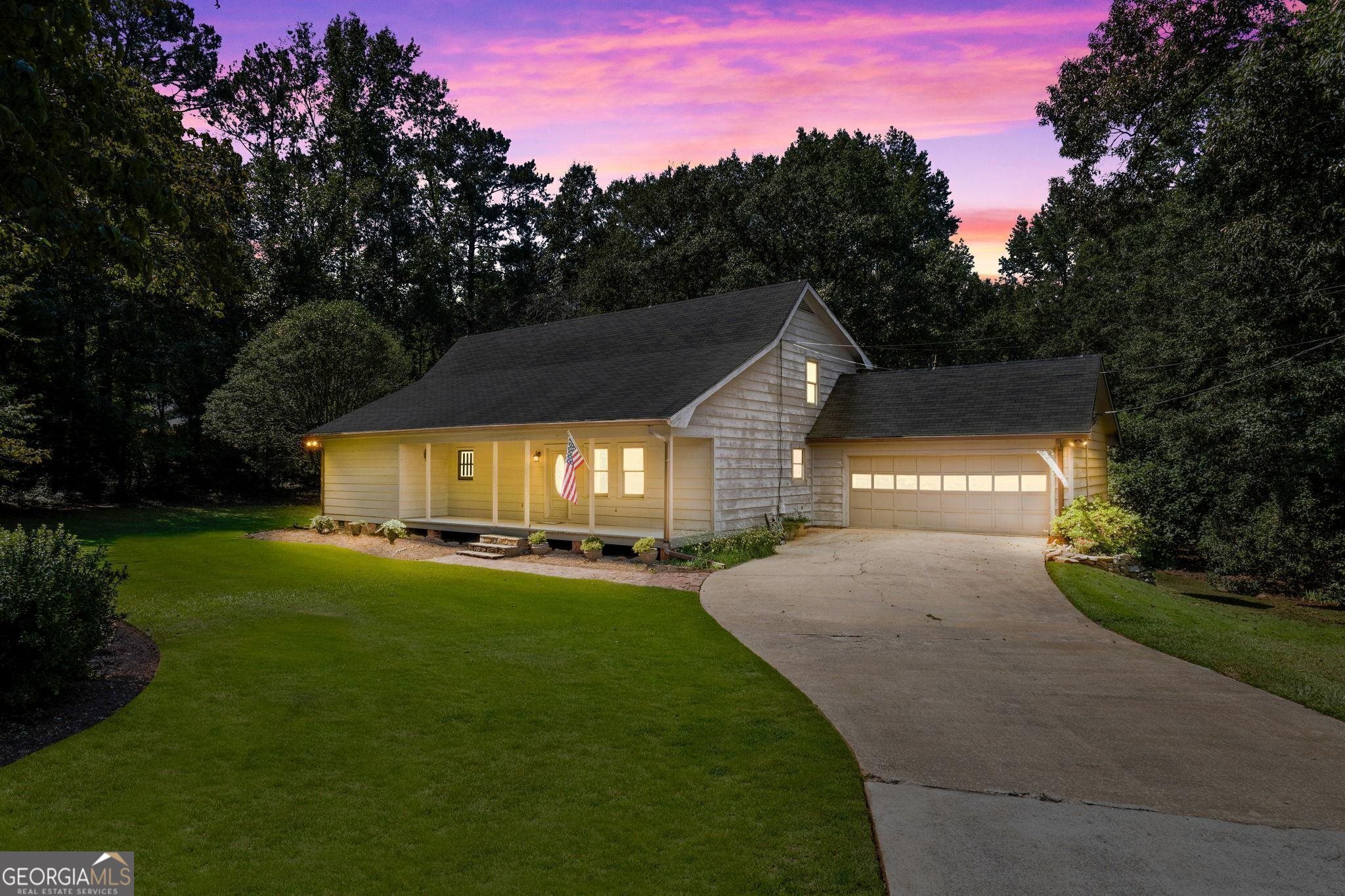 411 Elliott Road McDonough, GA 30252 - Photo 1 of 1 a front view of a house with a yard and garage