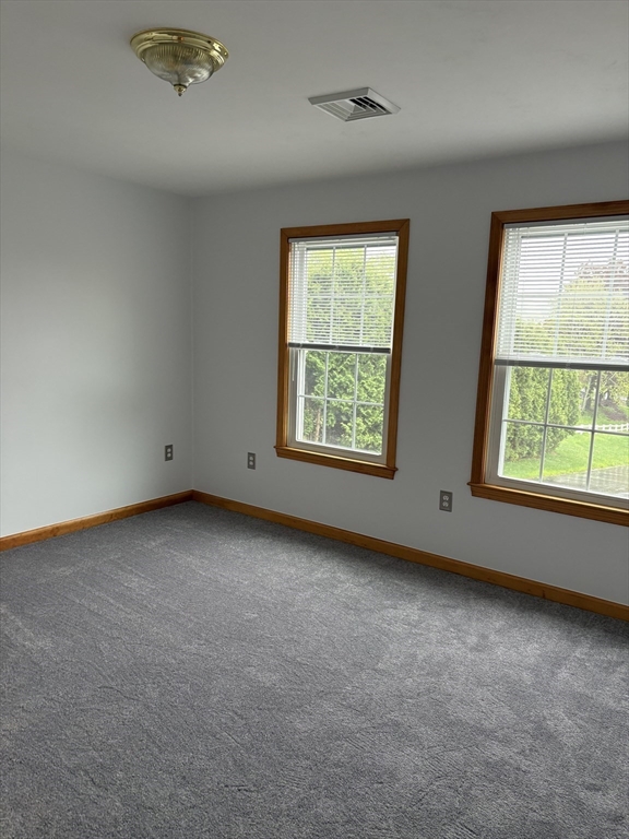 1 1/2 Main Street, Unit B Spencer, MA 01562 - Photo 10 of 18 an empty room with windows