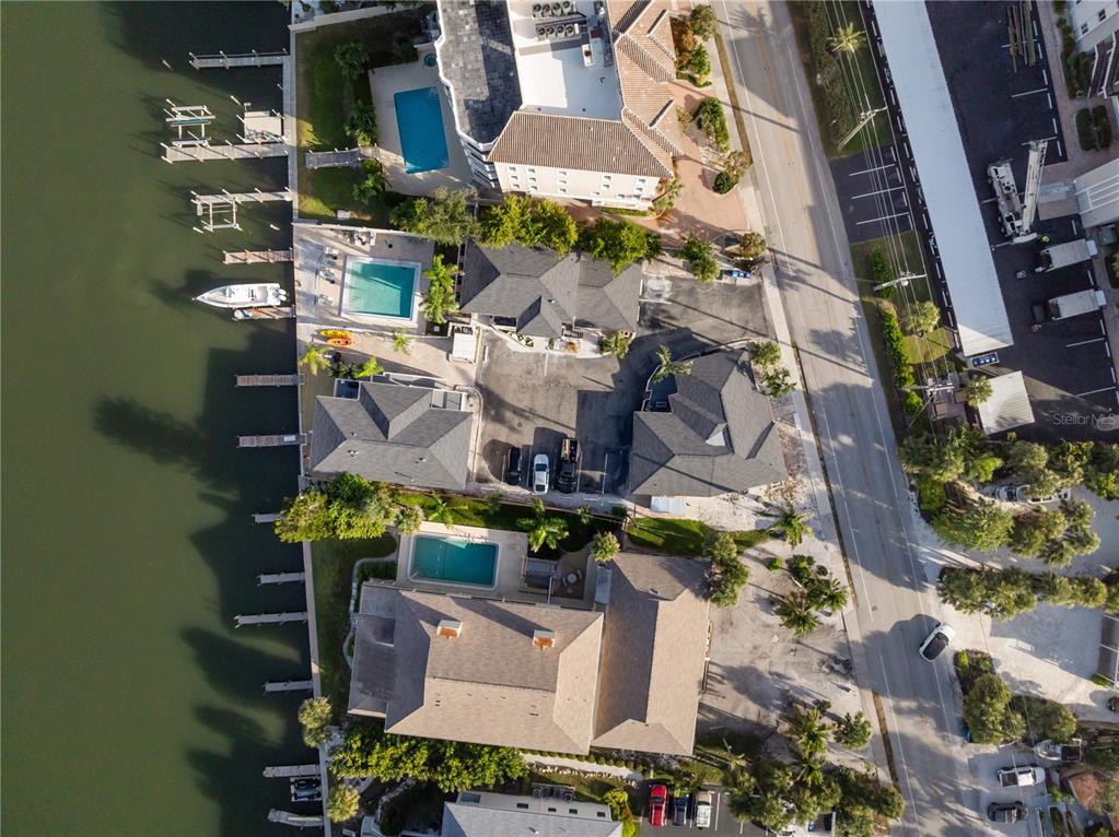 9022 Midnight Pass Road, Unit 112 Sarasota, FL 34242 - Photo 28 of 40 an aerial view of houses with outdoor space