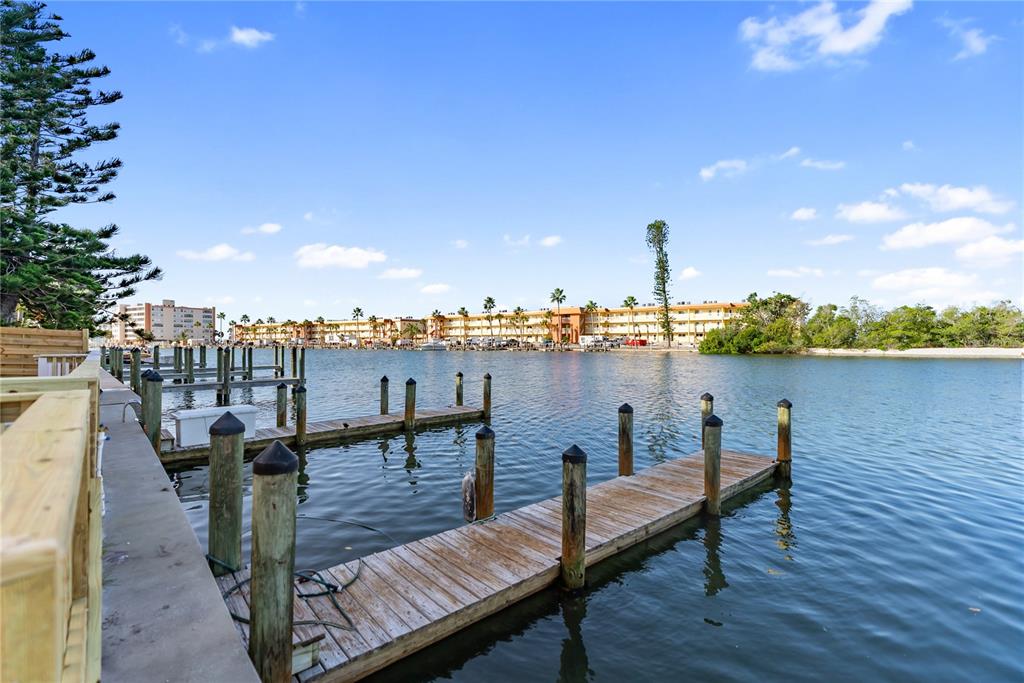 9022 Midnight Pass Road, Unit 112 Sarasota, FL 34242 - Photo 35 of 40 a view of a terrace with chairs