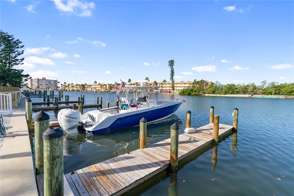 9022 Midnight Pass Road, Unit 112 Sarasota, FL 34242 - Photo 37 of 40 a view of a terrace with sitting area