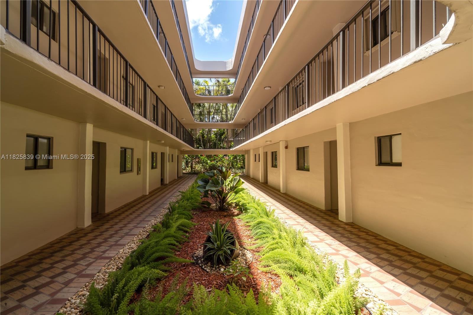 8400 Southwest 133rd Avenue Road, Unit 212 Miami, FL 33183 - Photo 2 of 32 a front view of a house with a yard